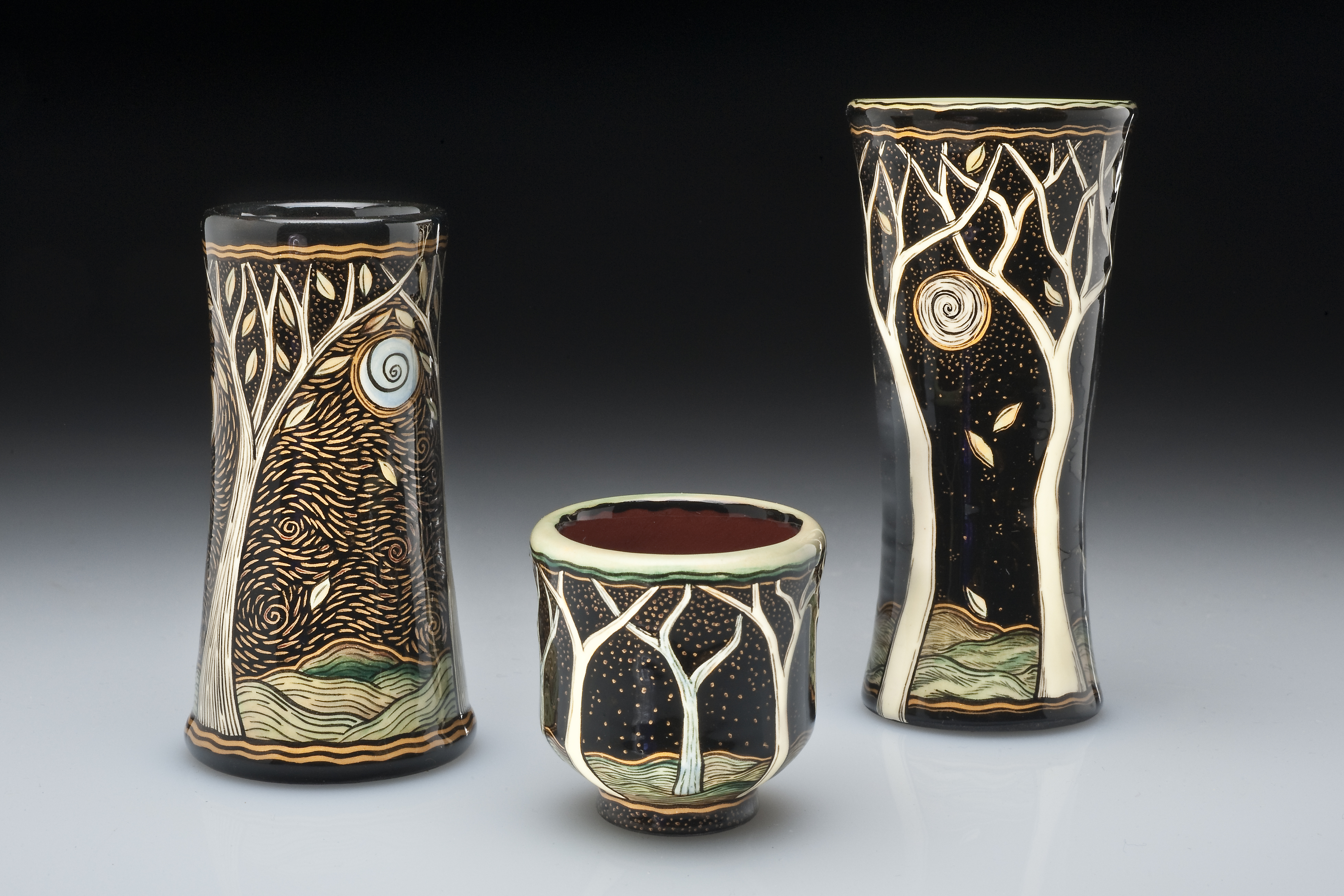 Decorated ceramic mugs by Terri Kern